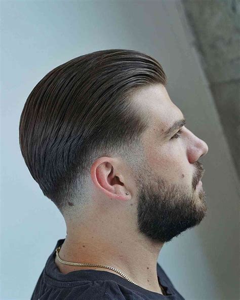 low skin fade slick back|slick back haircut with fade.